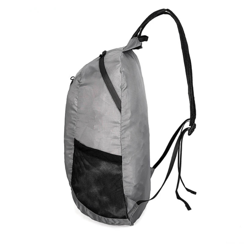 Gray backpack with black interior and straps on a white background