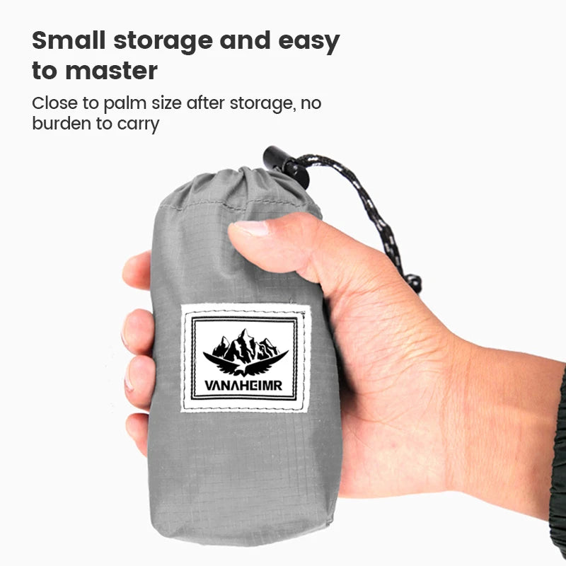 Gray drawstring bag held by a hand with 'Vanaheimr' branding, on a white background.
