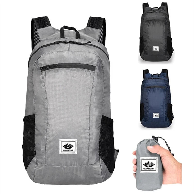 Gray backpack with black accents, shown open and folded, on a white background.