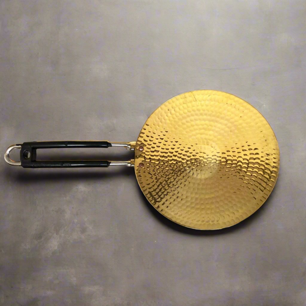 Eco-friendly and durable 10-inch brass chapati tawa with even heat distribution.