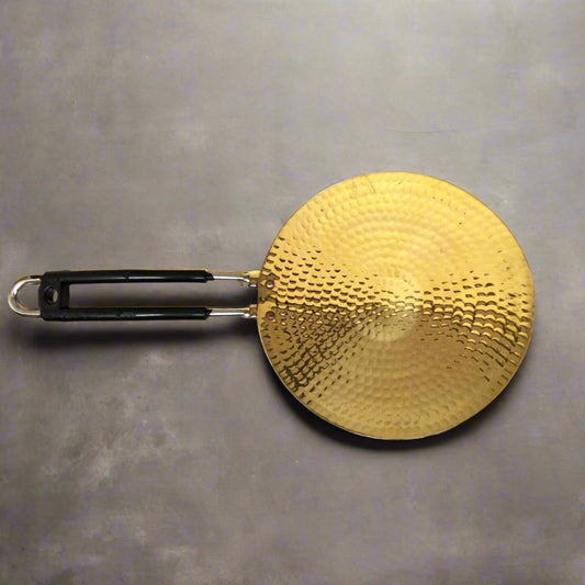 Eco-friendly and durable 10-inch brass chapati tawa with even heat distribution.