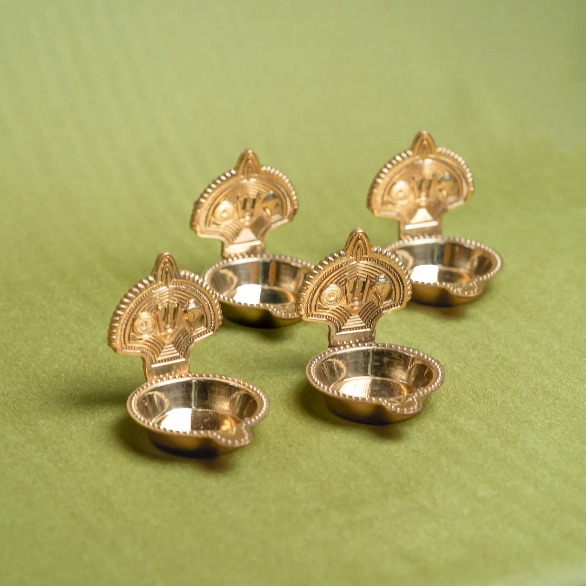 Brass Shankh Chakra Tilak Namah Diya – Set of 4 Handcrafted Traditional Oil Lamps